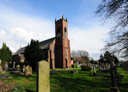 A photograph of Christ Church and graveyard in Woodford, Cheshire