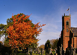 Autumn colours in the church yard taken by Evelyn Frearson