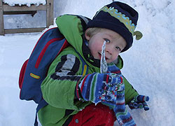 A photo of a child discovering icicles taken in Woodford Cheshire by Jo Rodman