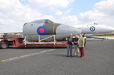 Vulcan nose cone and cockpit with Harry Harvey (Avro Heritage Ltd, Site owners), Harry Holmes of the Avro Heritage Centre, and Paul Rodman, Chairman of Woodford Community Council